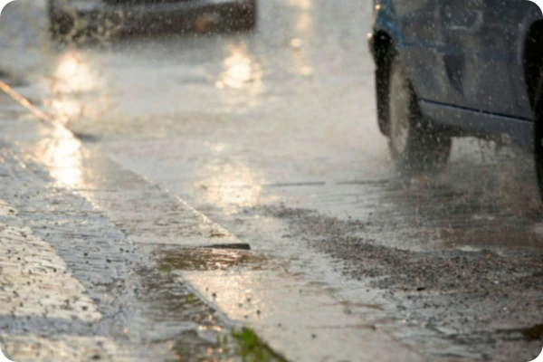 Rainwater on street with cars